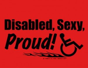 Red shirt, 50/50 heavyweight blend. Says: Disabled, sexy, Proud. Has an image of a speeding wheelchair with flames. Also comes as a button and a totebag!
